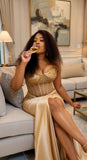 Champagne gold beaded satin evening gown with thigh high slit seated luxury dress detail