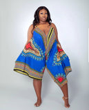 Woman wearing a colorful patterned vibrant African print outfit 