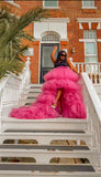Front view of fuchsia layered tulle skirt showing high-low silhouette and volume