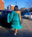 Back view of green sequin dress with fur trim one shoulder elegant evening dress