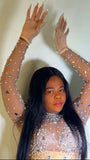 Close-up of rhinestone embellishment on nude mesh bodysuit showing intricate detailing