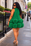 bright green sleeveless tulle dress with a tiered, pom-pom textured skirt